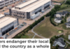 An Amazon data center sits next to a neighborhood in northern Virginia. Nathan Howard/Getty Images